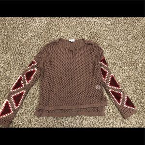 Crochet sweater with suede details on sleeves